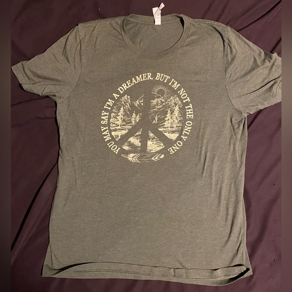 Women’s size large “Imagine” tee shirt, never worn.